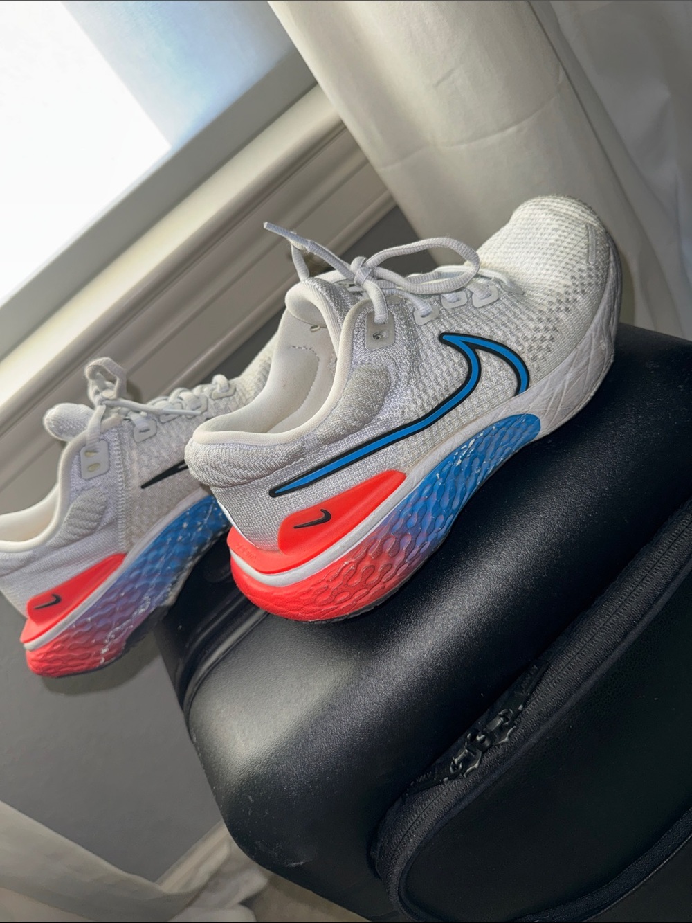 Nike White Running Shoes with Blue & Coral Accents